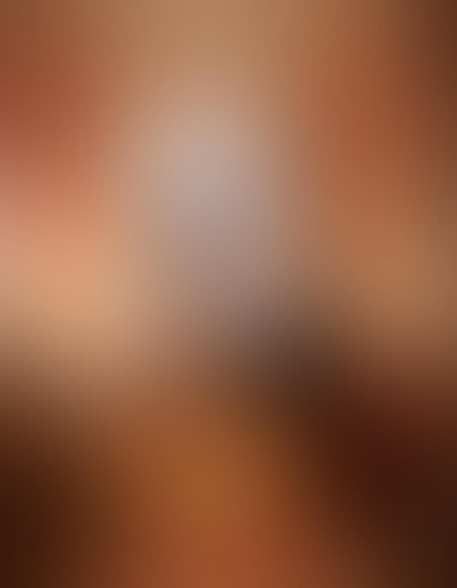 A romantic and intimate setting featuring a softly lit bedroom adorned with candles and rose petals. Two silhouettes of a couple leaning towards each other, with a hint of playful mystery in their poses. Soft, warm colors to evoke a sense of passion and allure, with delicate textures in the fabrics and decor. ethereal lighting casting gentle shadows, creating a dreamy atmosphere. super-realistic. warm tones.